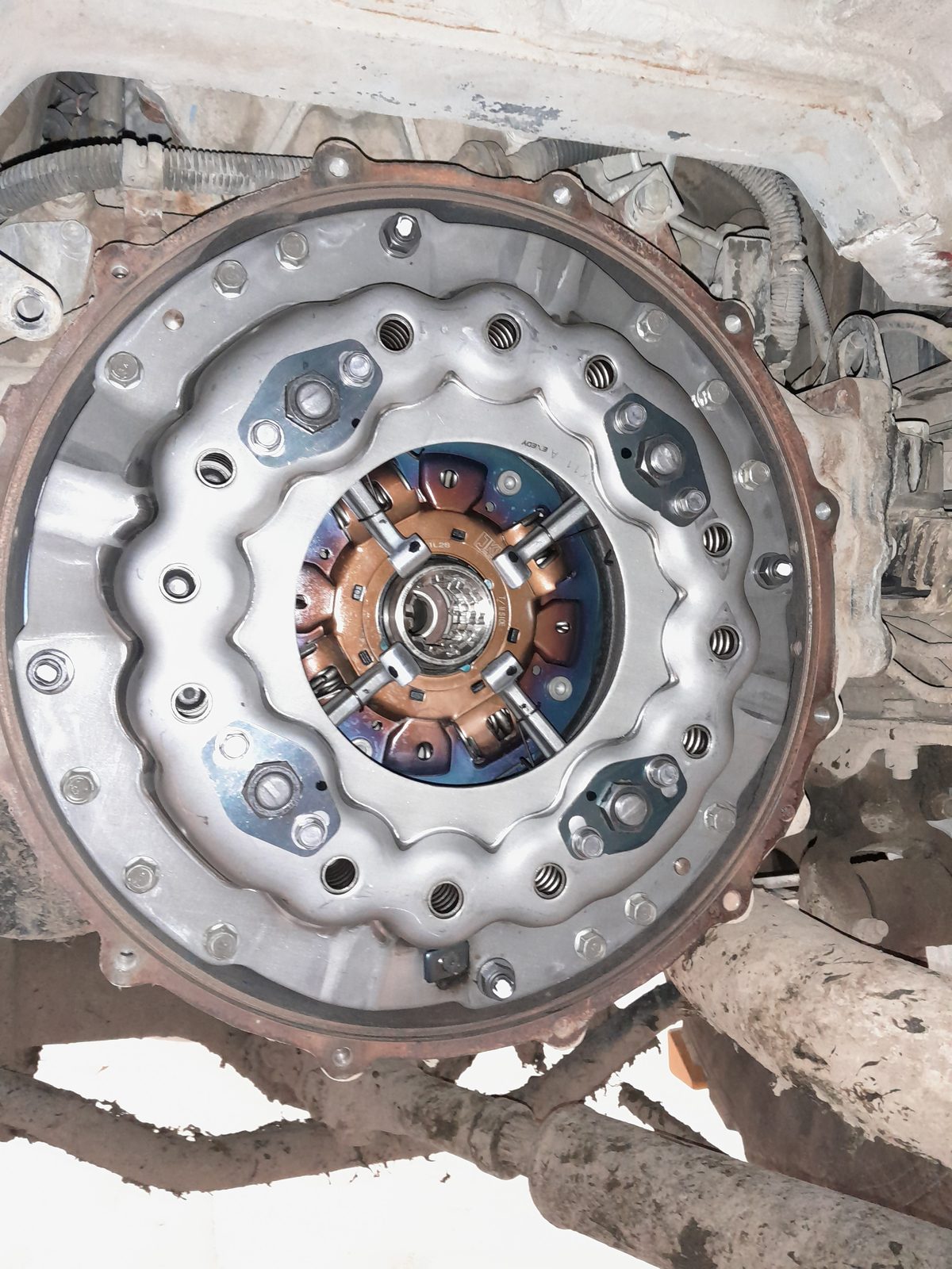 Clutch and flywheel assembly being serviced