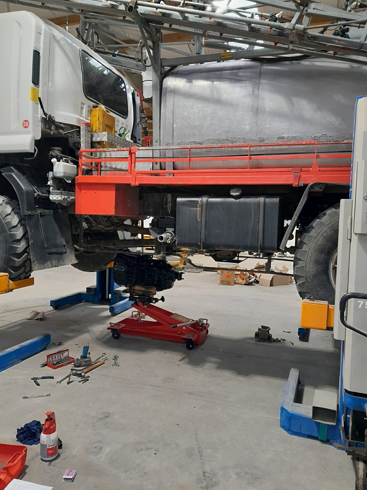 Truck in the AIS Methven workshop up on the hoist
