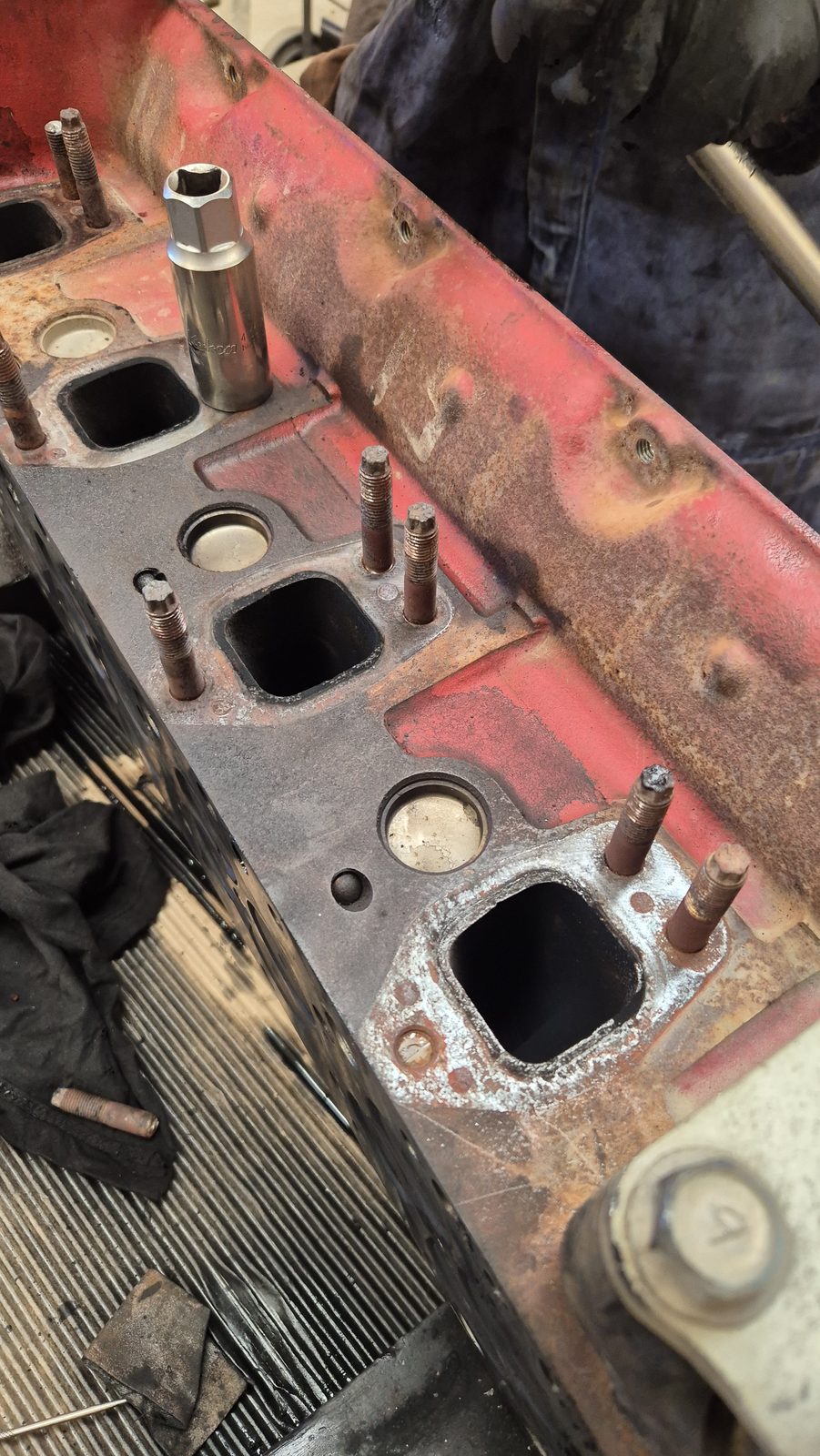 Cylinder head and manifold stripped for reconditioning